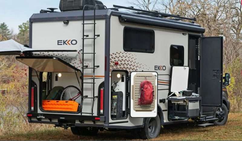 The storage compartments on a Winnebago EKKO motorhome are opened to show its cargo carrying capacity.