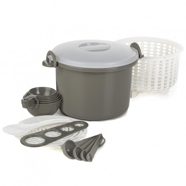 A plastic rice and pasta cooker set includes a gray plastic pot with clear lid, a white straining basket, gray nesting measuring cups and spoons, a gray pasta measuring tool, and a white rice serving spoon. 