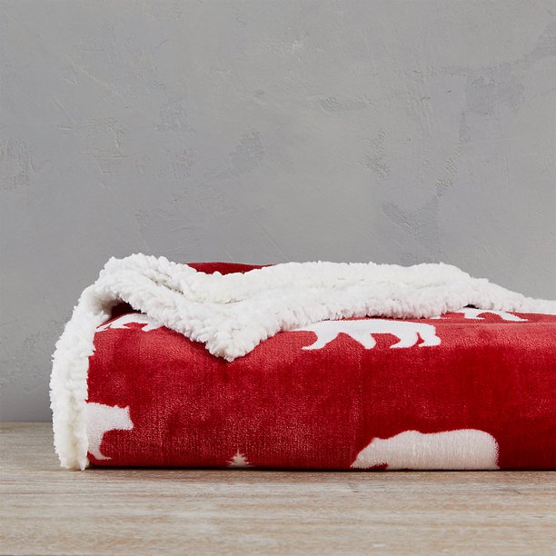 The Eddie Bauer blanket is bright red with white bears on one side and white fleece on the other side.