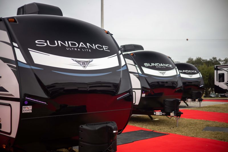 Three Heartland Sundance travel trailers sit in a row at the 2021 Florida SuperShow.