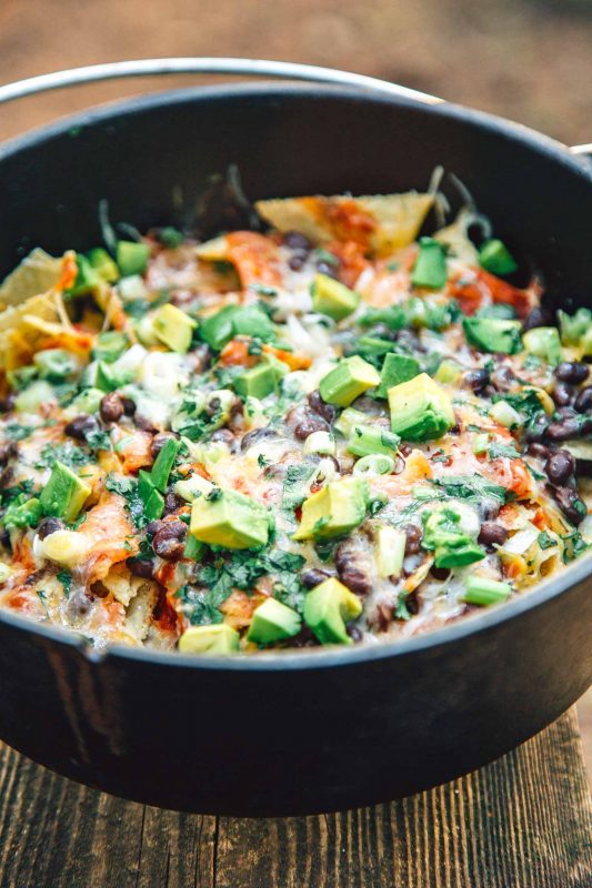 Freshly made Campfire Nachos in a Dutch oven waiting to be served.