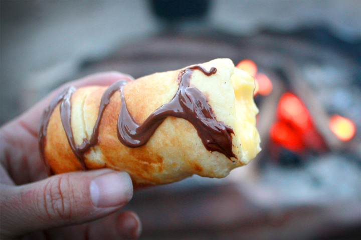 A finished Campfire Eclair with chocolate drizzled on top.
