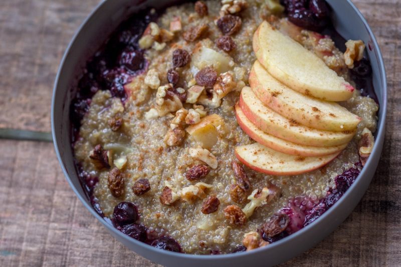 A freshly served Apple Pie Quinoa Porridge on a table.