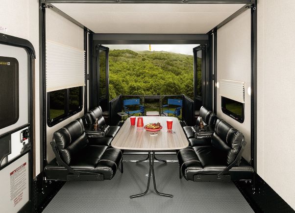 The garage area of the new Voltage fifth wheel toy hauler RV features large seating options