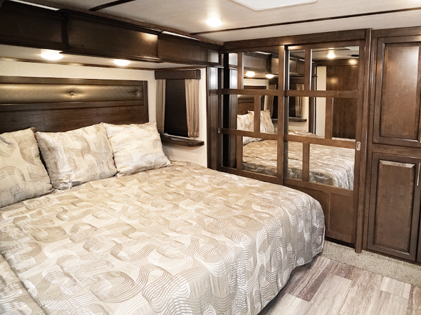 Master bedroom of the new Voltage fifth wheel toy hauler RV