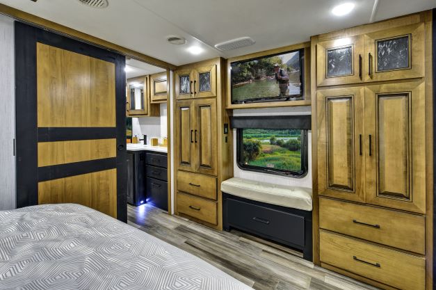 Master bedroom of the new Heartland Landmark Chesapeake fifth wheel RV has full size wardrobe storage