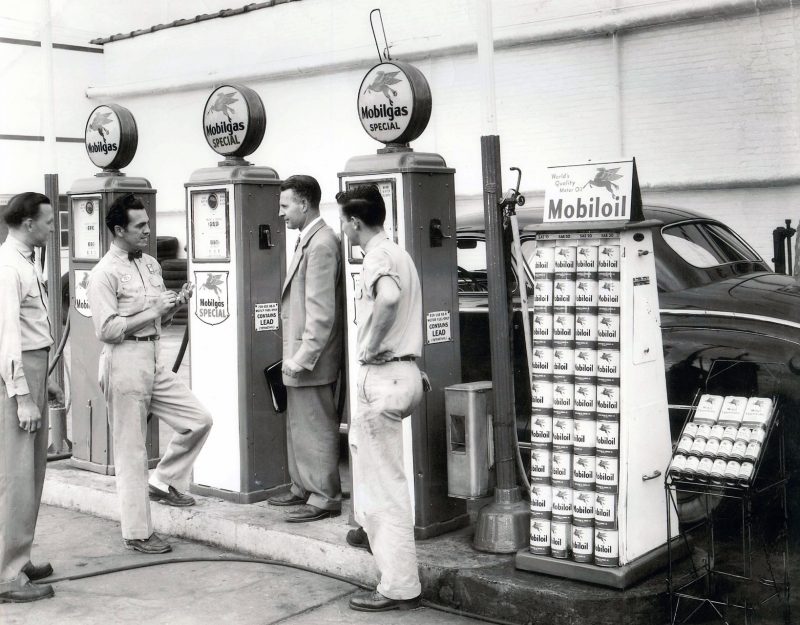 Abe Baidas and a group of men talking at the Mobile gas station. This is the grassroots of where General RV began.