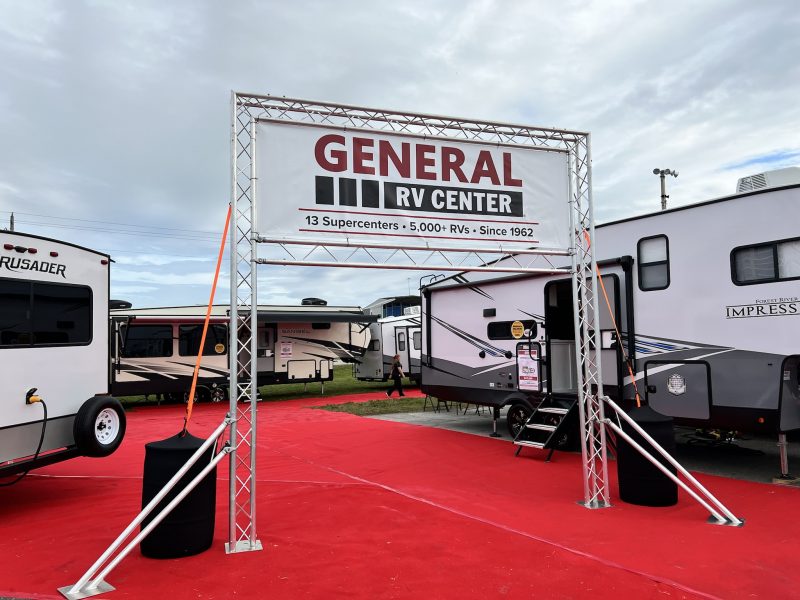 A group of RVs set up for an RV show.