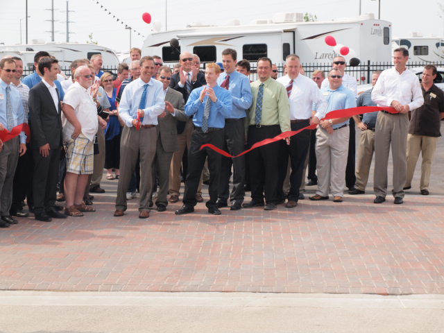 General RV employees cutting the ribbon in the opening ceremony.